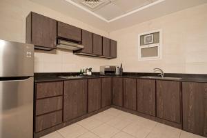 Kuchyň nebo kuchyňský kout v ubytování Action Hotel Ras Al Khaimah