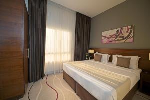 Postel nebo postele na pokoji v ubytování Action Hotel Ras Al Khaimah
