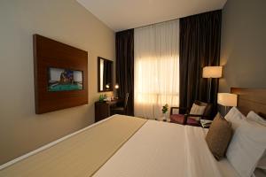 Postel nebo postele na pokoji v ubytování Action Hotel Ras Al Khaimah