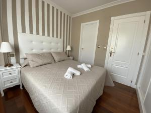 Postel nebo postele na pokoji v ubytování Villa OLYMPIA
