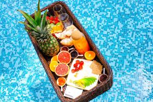 a tray of fruit and vegetables in a plastic box at Harmonia Bungalows & Pool in Sveti Stefan