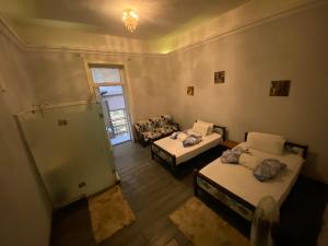 Voodi või voodid majutusasutuse cairo central house toas