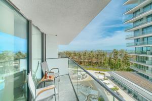 a balcony with a view of a building at Your Holidays Waves B431 in Międzyzdroje