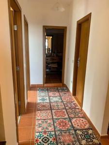 a hallway with a rug on the floor of a room at 2 bedroom "Pine Hug" apartment in Borovets