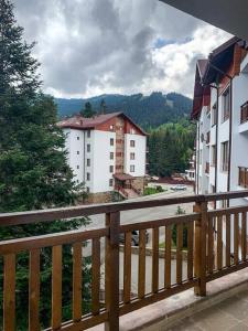 a view of a city from a balcony with buildings at 2 bedroom "Pine Hug" apartment in Borovets