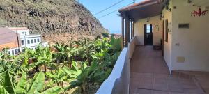 a view of a building with a mountain in the background at Casa Pepito in Agulo