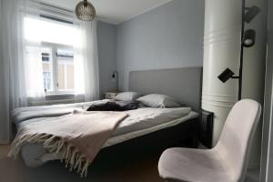 Säng eller sängar i ett rum på Lönngården