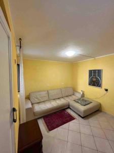 a living room with a couch in a room at Tenuta Balabaia, Townhouse. in Caccamo