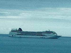 a large cruise ship sitting in the ocean at Diaz De Valle 35 in Mossel Bay