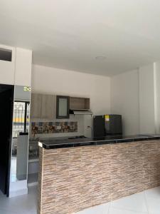 a kitchen with a counter top in a room at APARTAMENTO DORADAL in Doradal