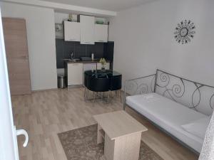 a living room with a couch and a table at Apartment AB Batala in Dubrovnik
