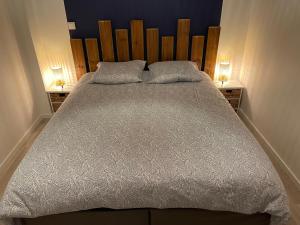 En eller flere senge i et værelse på Maison centre bourg à 50m de la plage