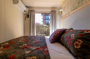 En eller flere senge i et værelse på E-senses guesthouse - chalés românticos e pet-friendly em Campos do Jordão