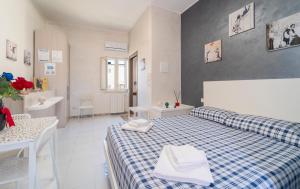 Postel nebo postele na pokoji v ubytování B&B Eraclio