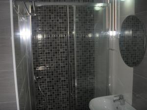 a bathroom with a shower and a toilet and a sink at Katerina Lefkada in Vasiliki