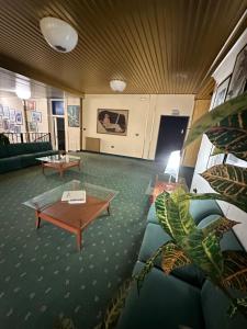 a living room with a couch and a coffee table at HOTEL ATENA in Cirò Marina