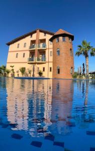 a building sitting on top of a body of water at Rambuje Resort in Lezhë