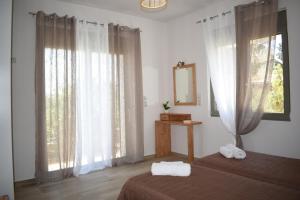 Postel nebo postele na pokoji v ubytování Elixrysos Apartment 1