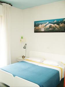 מיטה או מיטות בחדר ב-Hotel Tuscolano