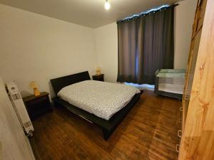 a bedroom with a bed and a window at chez Effat et marie T A C 1 in Saint-Aignan