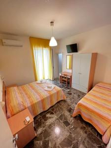 Кровать или кровати в номере Hotel Lido Vieste