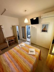 Кровать или кровати в номере Hotel Lido Vieste