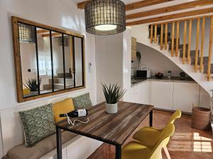 a kitchen and dining room with a table and chairs at El Rincón de Mariela By Travel Home in Segura de la Sierra