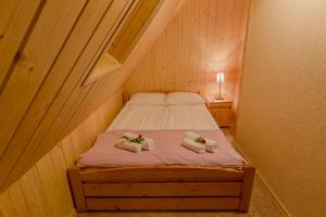 Posteľ alebo postele v izbe v ubytovaní Apartament Kościeliska 10A