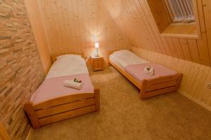 Posteľ alebo postele v izbe v ubytovaní Apartament Kościeliska 10A