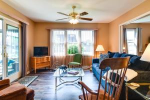 a living room with a couch and a table at Tonawanda Vacation Rental about 13 Mi to Niagara Falls in Tonawanda
