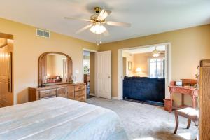 a bedroom with a bed and a ceiling fan at Tonawanda Vacation Rental about 13 Mi to Niagara Falls in Tonawanda
