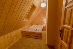 Posteľ alebo postele v izbe v ubytovaní Apartament Kościeliska 10A