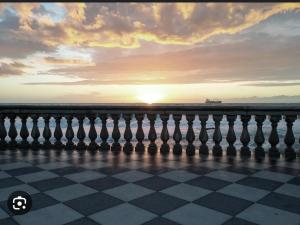 a chess board with the sunset in the background at Due passi dal mare in Livorno
