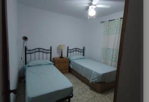 Posteľ alebo postele v izbe v ubytovaní Casa El Jazmín