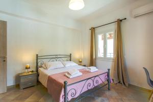 Llit o llits en una habitació de Kampos Kassiopi Apartment