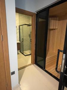 a room with a glass door and a mirror at Uzungöl Bungalow in Uzungol +51 photos