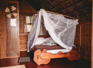 Postel nebo postele na pokoji v ubytování Art Jungle Eco Lodge + 37 fotografií