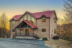 a large wooden house with a red roof at Soaring Eagle in Sautee Nacoochee