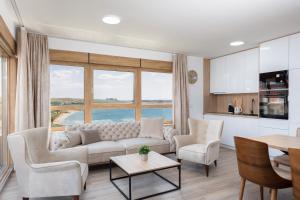 a living room with a couch and a table at Salt&Soul Residence in Povljana