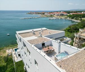 an aerial view of a house with the water at Salt&Soul Residence in Povljana