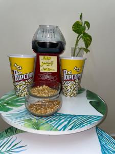 a plate with a jar of popcorn and two cups at Villa ain soltan in Imouzzer du Kandar