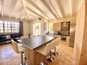 a kitchen with a large wooden table and chairs at Nerria's Villa in Kalamaki Chanion