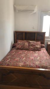 Ένα ή περισσότερα κρεβάτια σε δωμάτιο στο قريه رمسيس الساحل الشمالي