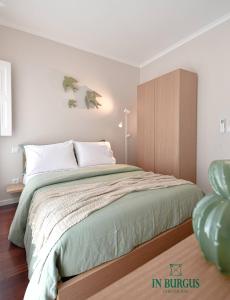 Postel nebo postele na pokoji v ubytování In Burgus guest house