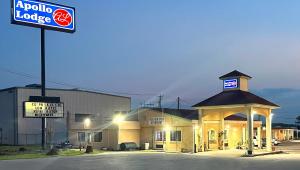 a petrol station with a sign in front of it at Apollo Lodge and RV Park in Fairfield