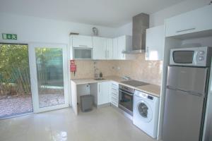 Η κουζίνα ή μικρή κουζίνα στο Forest Village Exótic