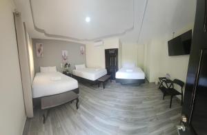 En eller flere senger på et rom på Mi Tierra Hotel y Restaurante