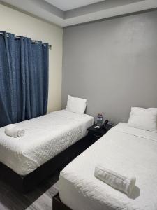 Mi Tierra Hotel y Restaurante tesisinde bir odada yatak veya yataklar