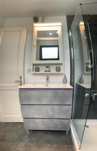 a bathroom with a sink and a mirror at Apartamentos Albatros in Puerto del Carmen