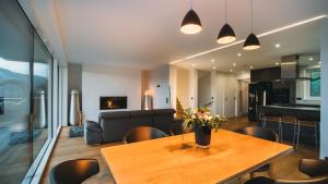 a living room with a table and a couch at Panorama Chalet Fastenberg in Schladming